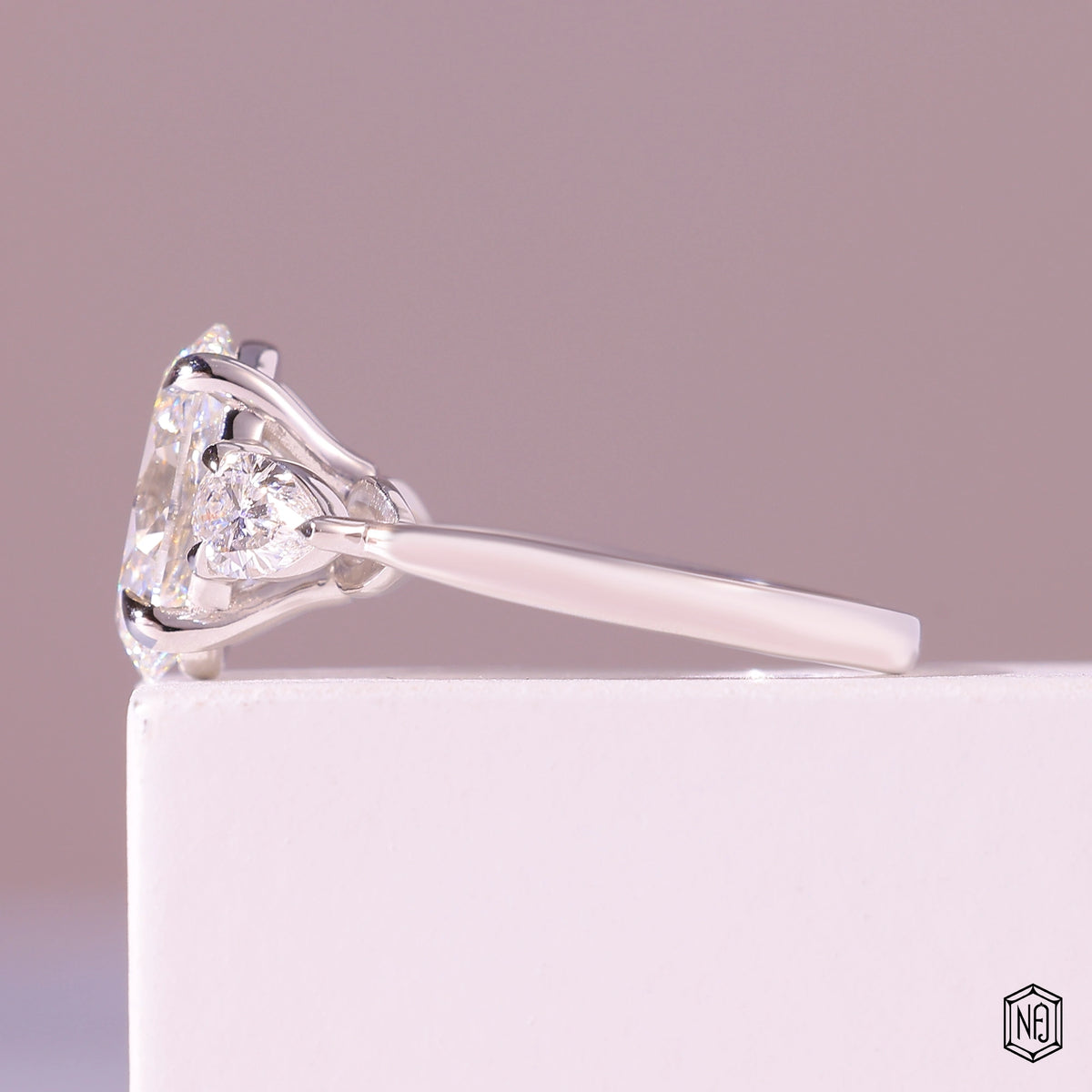 3.19 Carat Oval Cut Lab Grown Diamond Trellis Three-Stone Engagement Ring - Angled Perspective