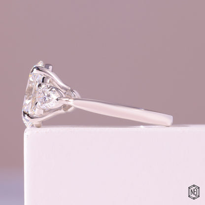 3.19 Carat Oval Cut Lab Grown Diamond Trellis Three-Stone Engagement Ring - Angled Perspective