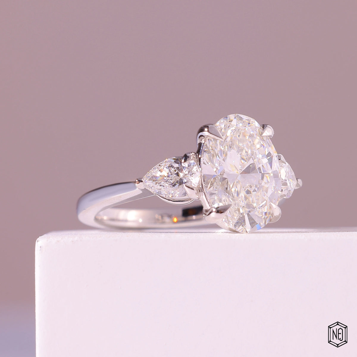 3.19 Carat Oval Cut Lab Grown Diamond Trellis Three-Stone Engagement Ring - Gallery & Prongs Detail