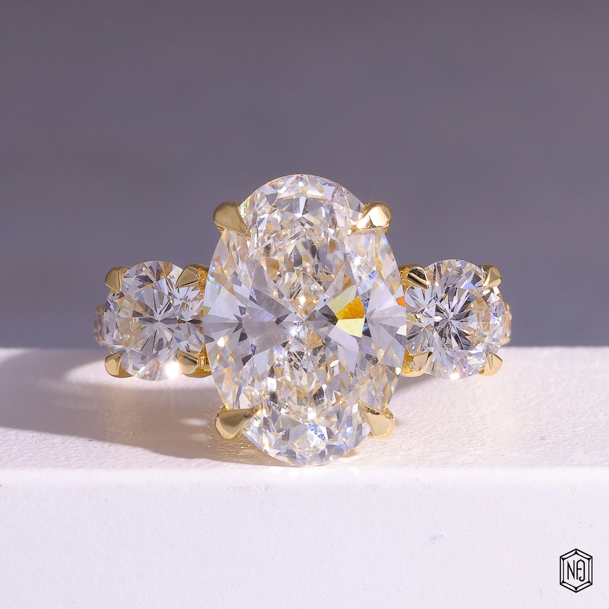 6.08 Carat Oval Cut Lab Grown Diamond Trellis Three-Stone Engagement Ring - Front Top View