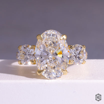 6.08 Carat Oval Cut Lab Grown Diamond Trellis Three-Stone Engagement Ring - Front Top View