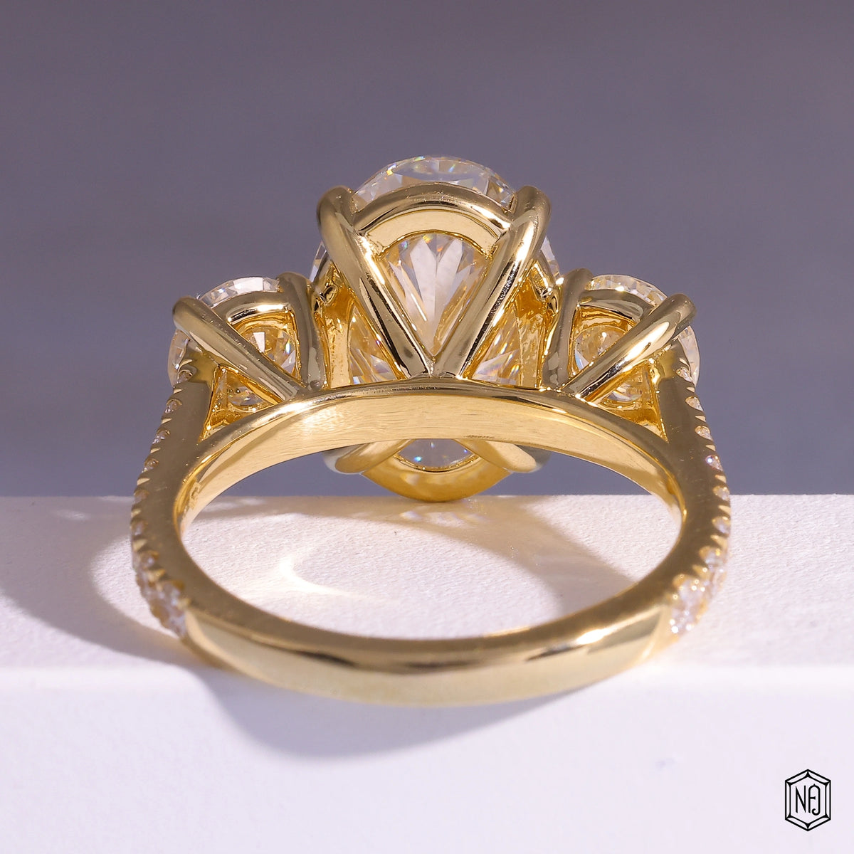 6.08 Carat Oval Cut Lab Grown Diamond Trellis Three-Stone Engagement Ring - Hand View / Detail Angle
