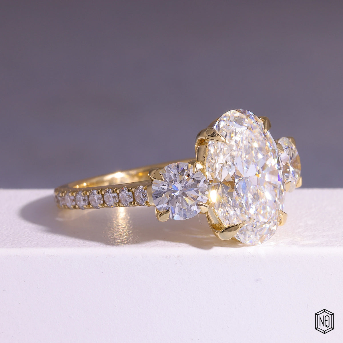 6.08 Carat Oval Cut Lab Grown Diamond Trellis Three-Stone Engagement Ring - Gallery & Prongs Detail