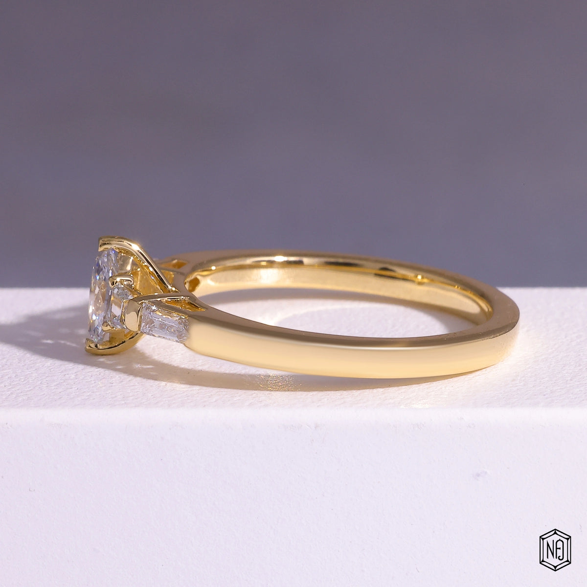 0.24 Carat Marquise Cut Lab Grown Diamond Trellis Three-Stone Engagement Ring - Angled Perspective