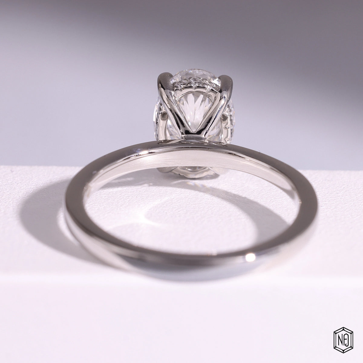 1.44 Carat Oval Cut Lab Grown Diamond Delicate Hidden Halo Engagement Ring - Hand View / Detail Angle