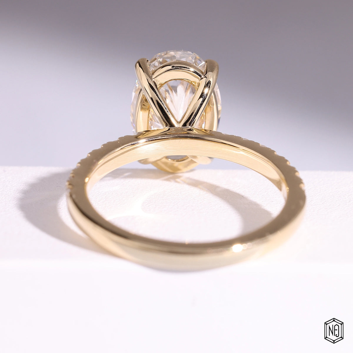 3.22 Carat Oval Cut Lab Grown Diamond Side Stone Pavé Engagement Ring - Hand View / Detail Angle