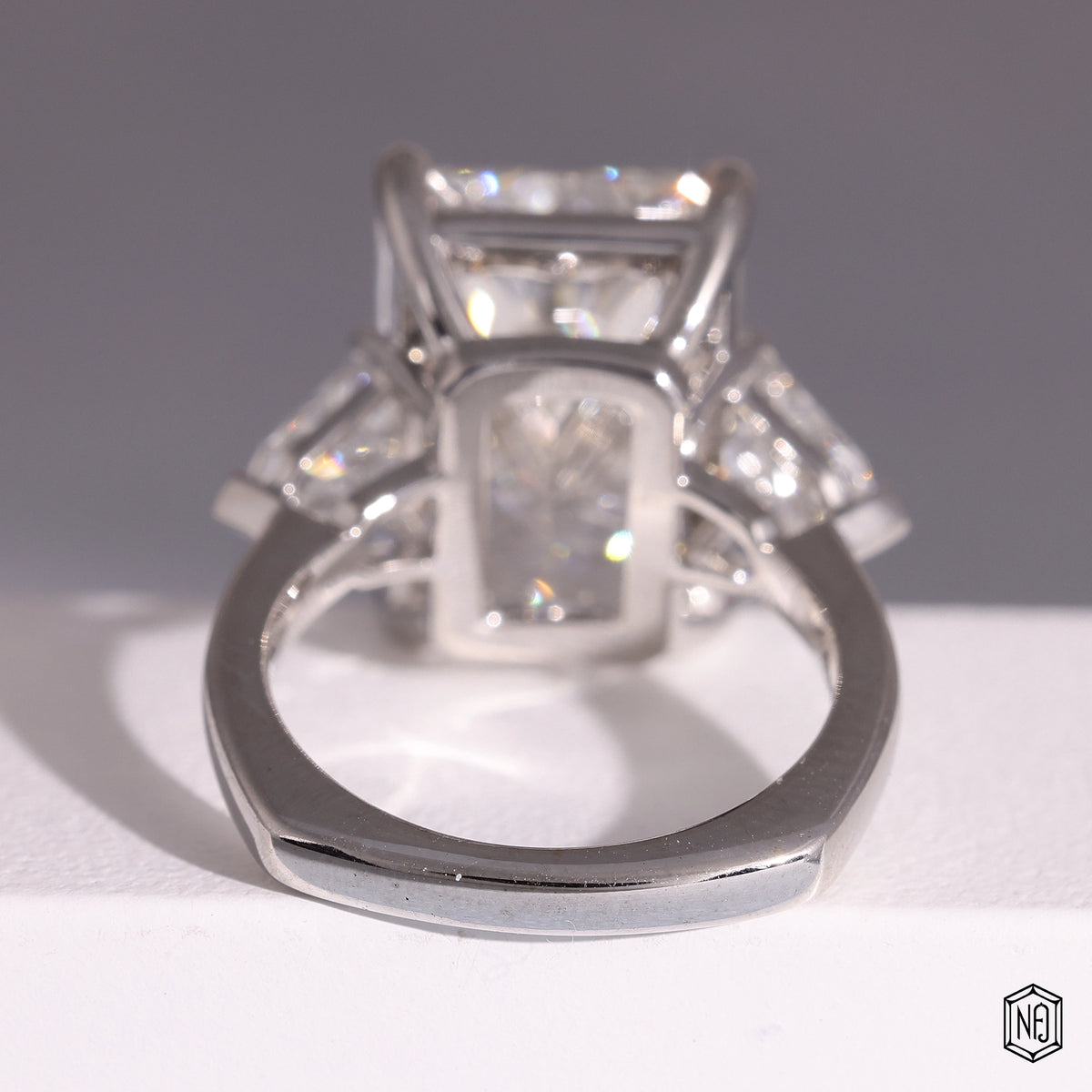 9.58 Carat Radiant Cut Lab Grown Diamond Trellis Three-Stone Engagement Ring - Hand View / Detail Angle