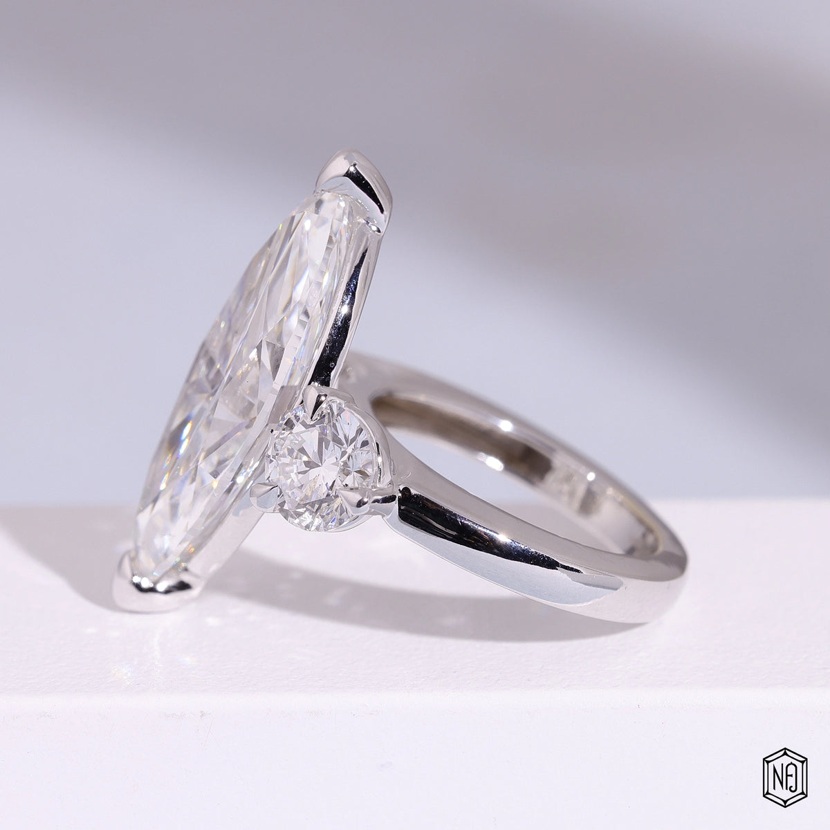 9.57 Carat Marquise Cut Lab Grown Diamond Trellis Three-Stone Engagement Ring - Angled Perspective