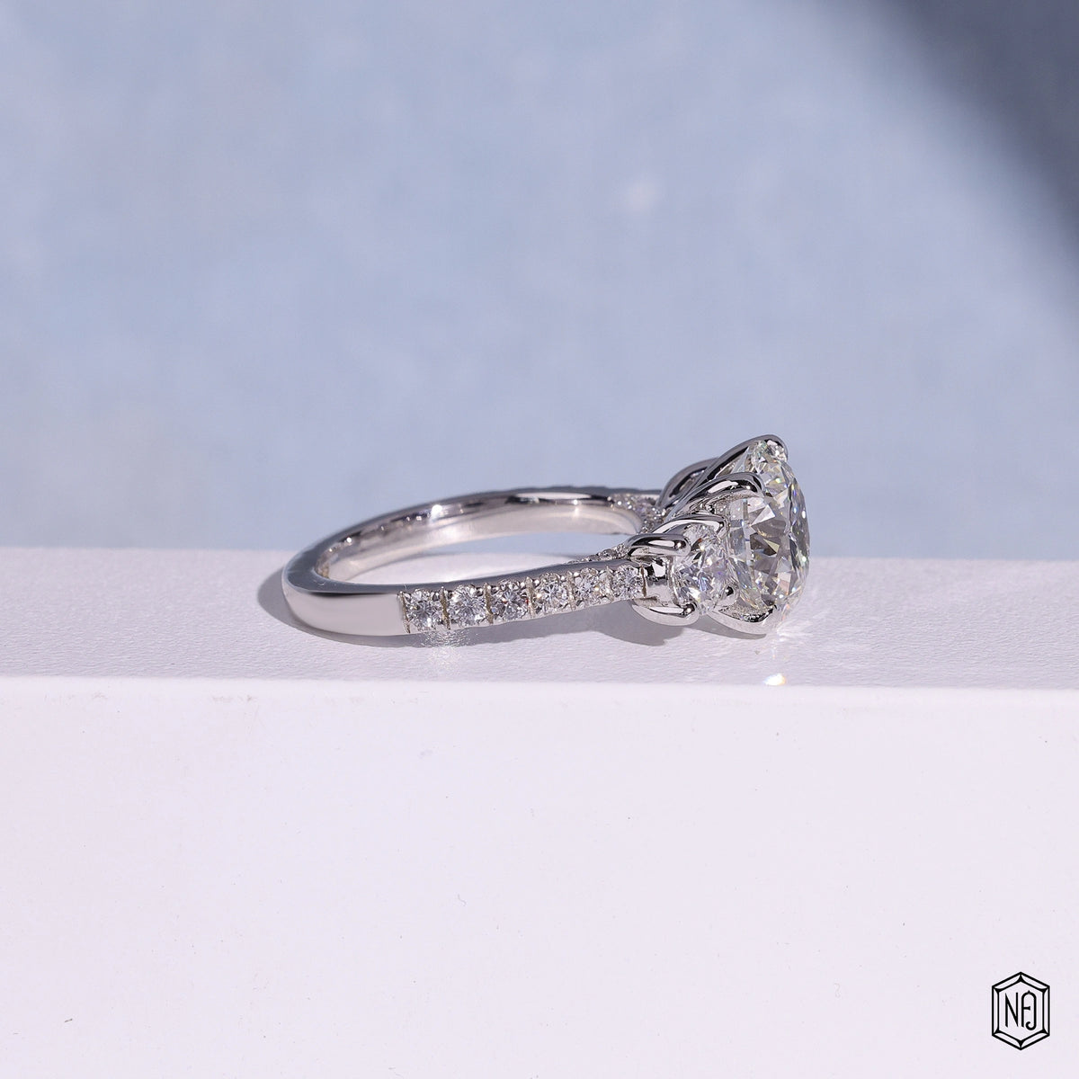 3.12 Carat Round Cut Lab Grown Diamond Trellis Three-Stone Engagement Ring - Side Profile Angle