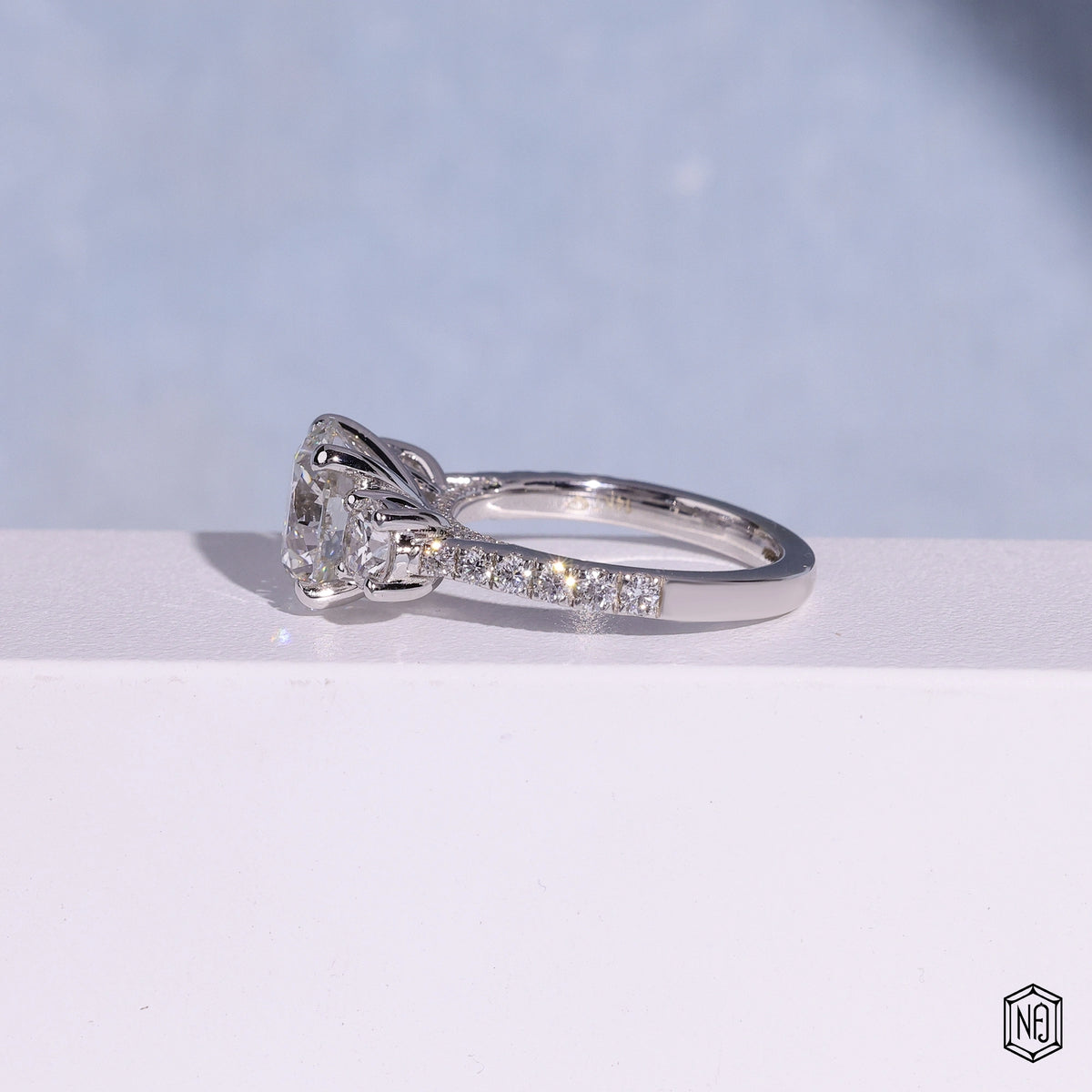 3.12 Carat Round Cut Lab Grown Diamond Trellis Three-Stone Engagement Ring - Angled Perspective