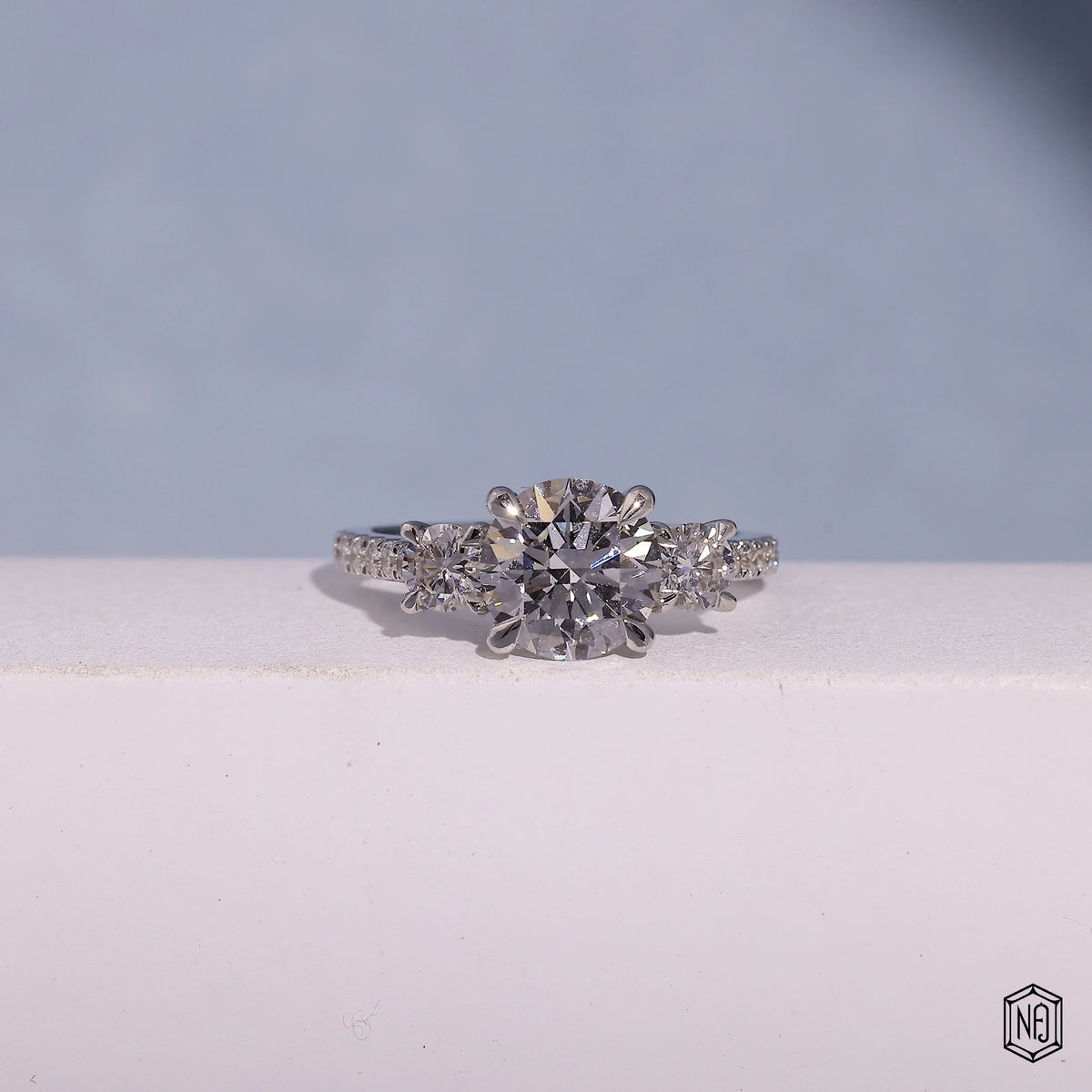 1.73 Carat Round Cut Lab Grown Diamond Trellis Three-Stone Engagement Ring - Front Top View