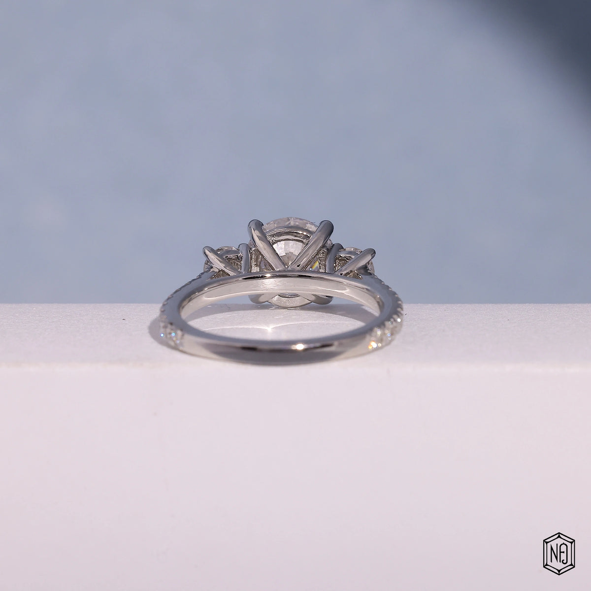 1.73 Carat Round Cut Lab Grown Diamond Trellis Three-Stone Engagement Ring - Angled Perspective