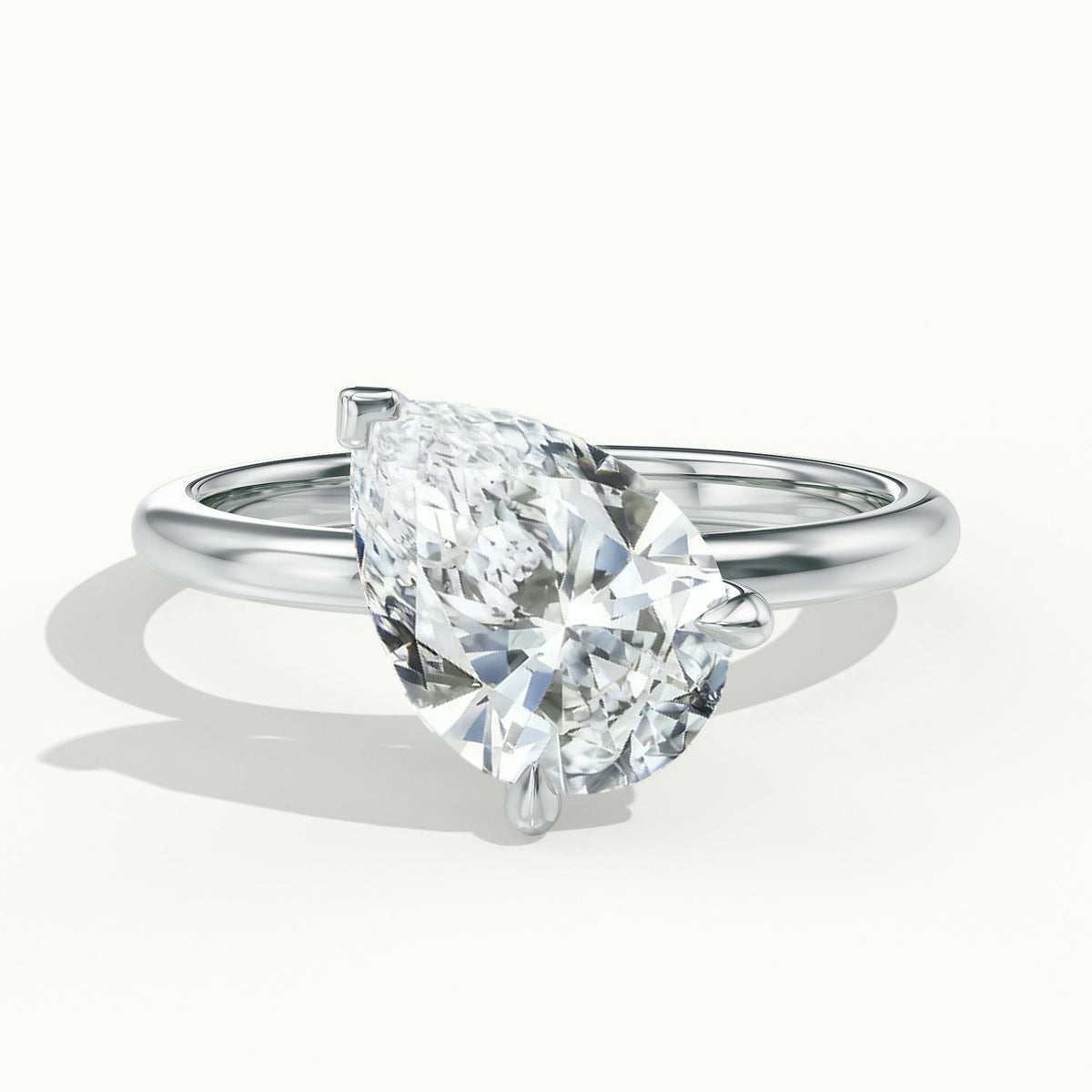 Adela Tilted 4 Carat Pear Lab Grown Diamond Hidden Halo Engagement Ring in Platinum - view 1