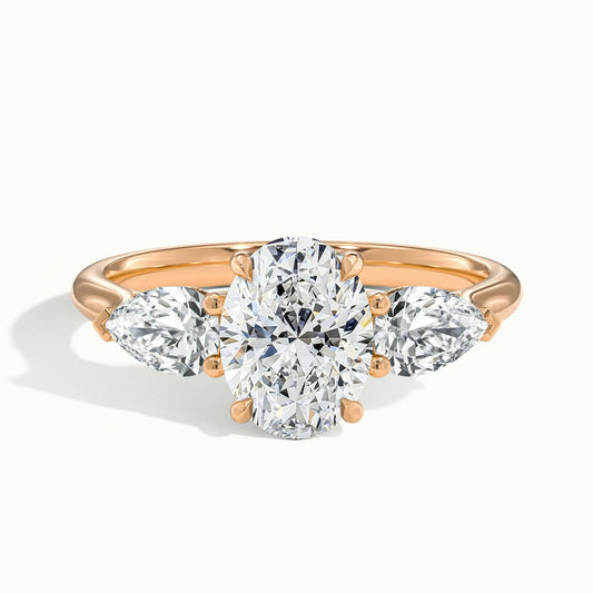 Remy 2.5 Carat Oval Lab Grown Diamond Three Stone Engagement Ring in 18K Rose Gold - view 1