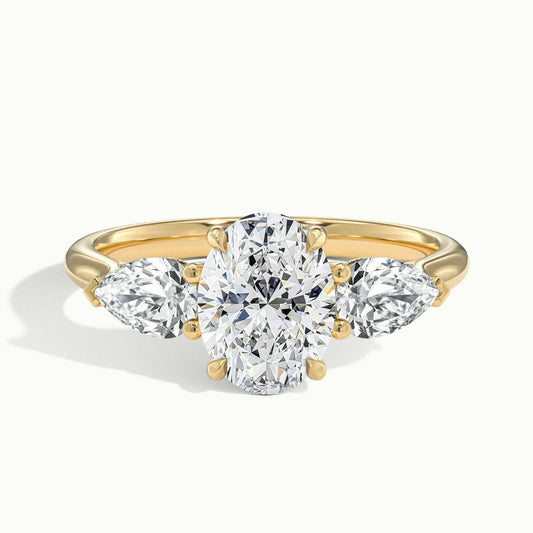 Remy 2.5 Carat Oval Lab Grown Diamond Three Stone Engagement Ring in 18K Yellow Gold - view 1